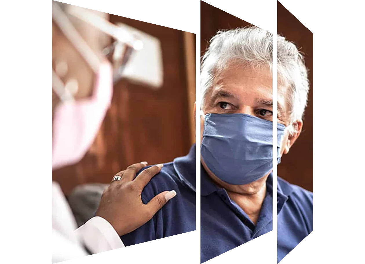 Female doctor with her hand on the shoulder of a male patient