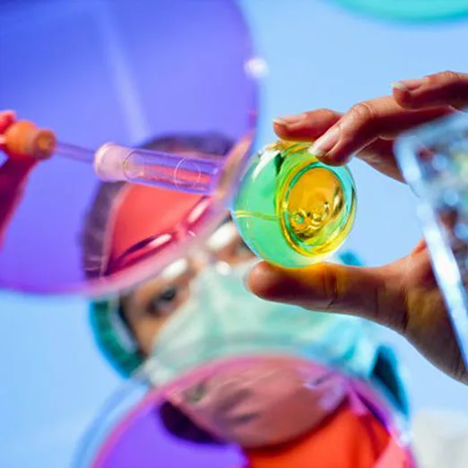 Chemist working in a hospital lab wearing protective gear