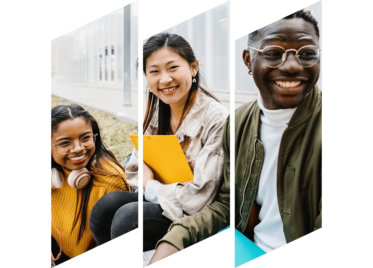 A woman with a bright smile looks at her laptop.