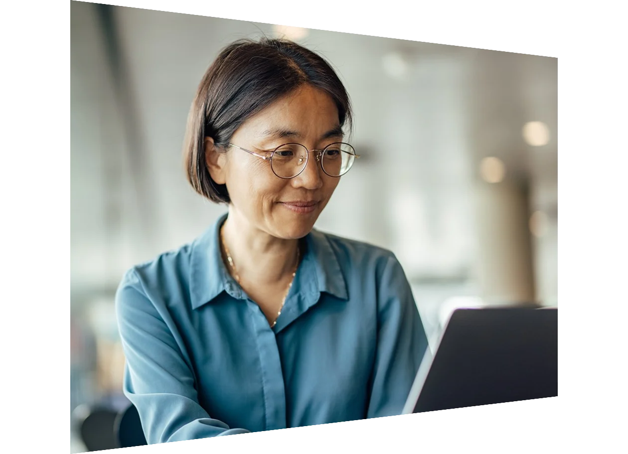 Female author working on laptop in office