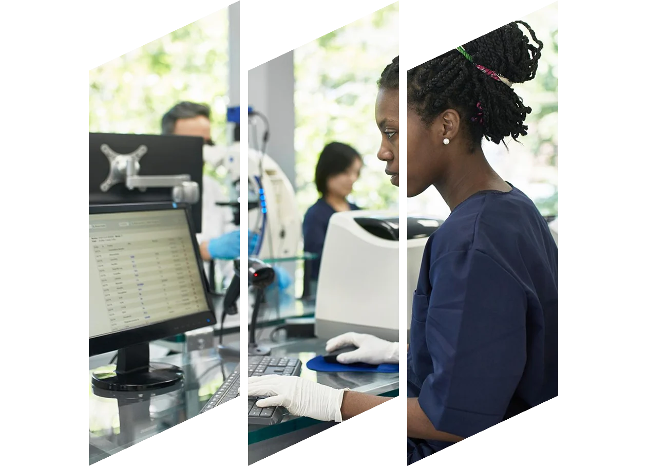 African Pathology Technician working on a computer in the lab