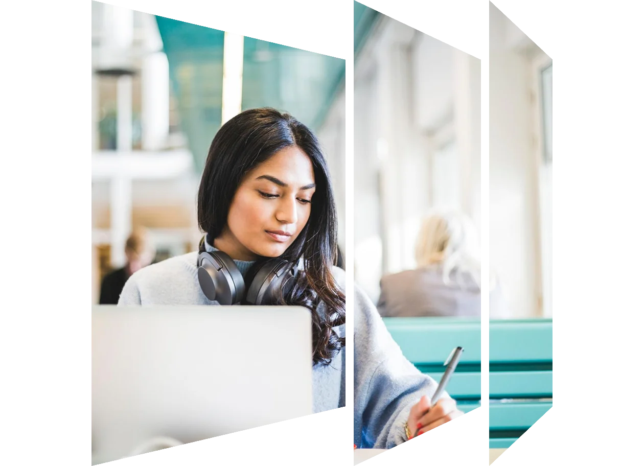 Young female student studying at cafeteria in university