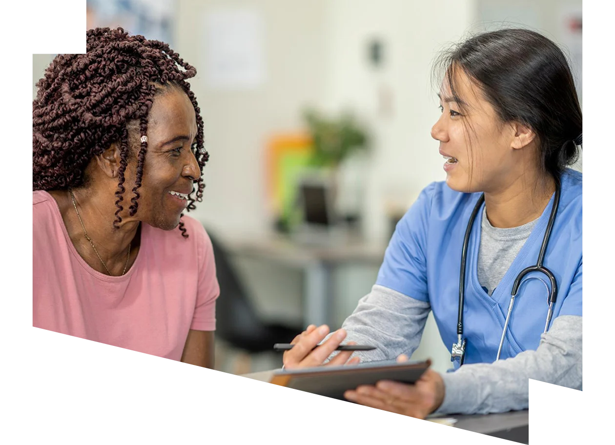 Young woman feeding her baby a bottle