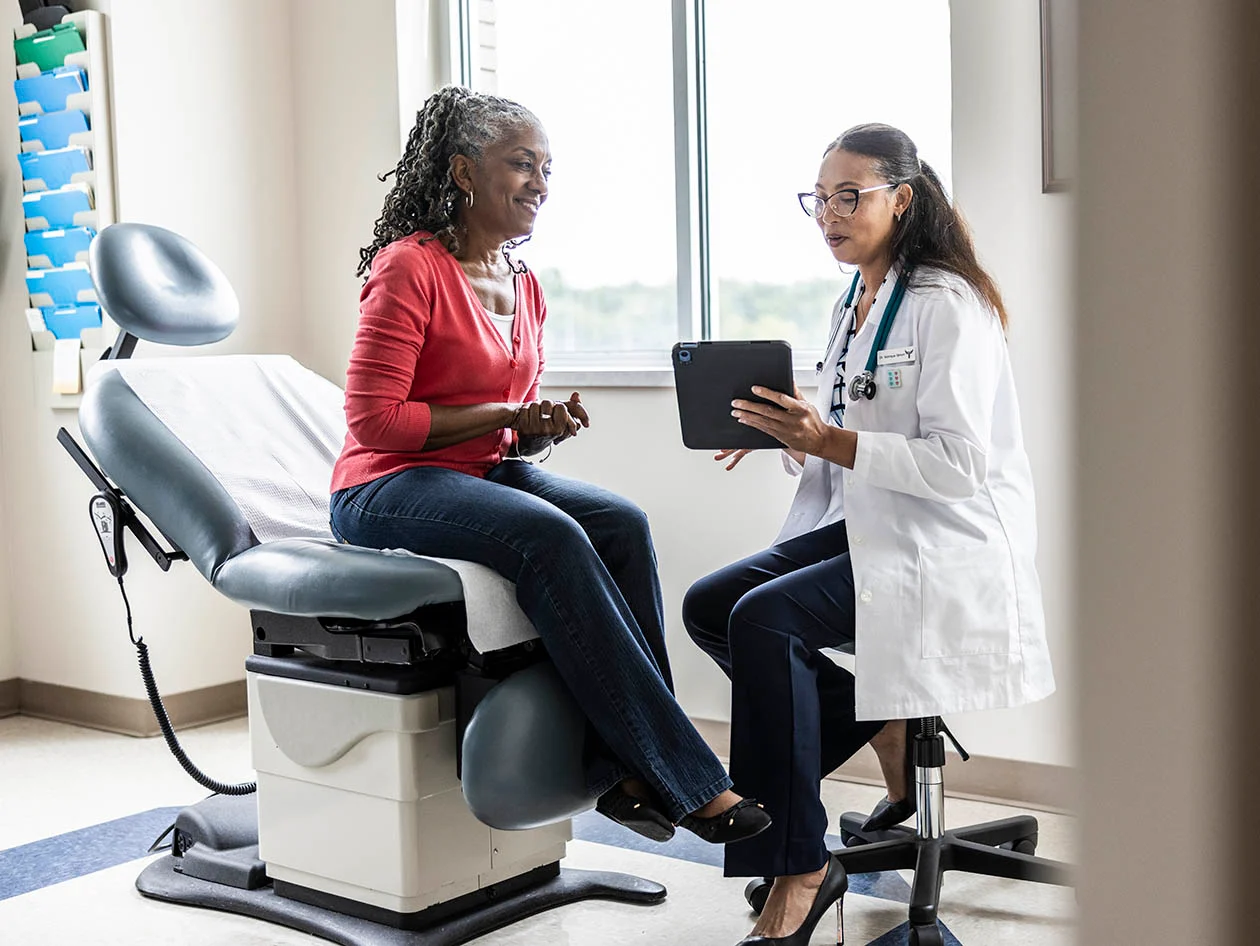 Stock image depicting a female physician showing a tablet to a patient (Source: MoMo Productions/DigitalVision via Getty Images)