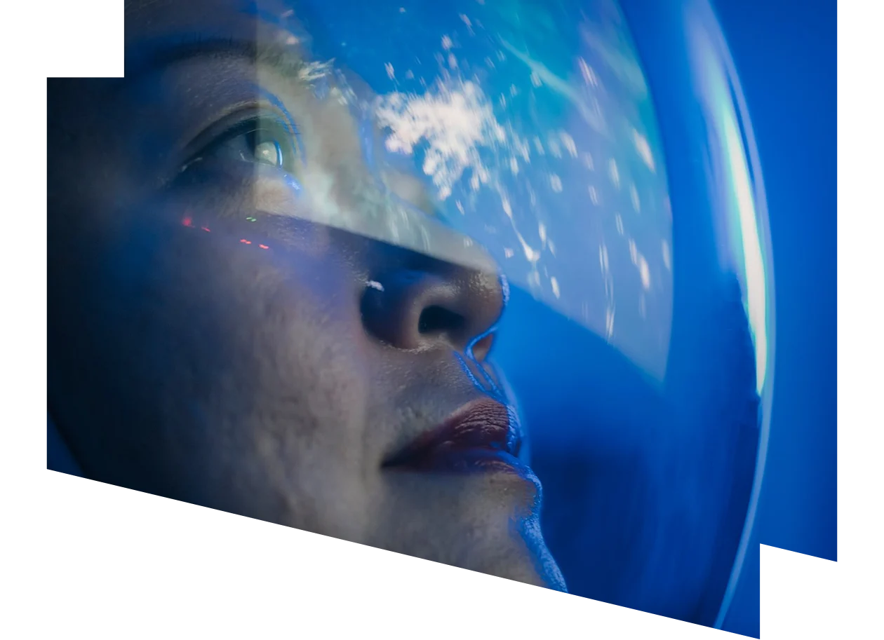 Chinese female astronaut looking at earth through window from spaceship