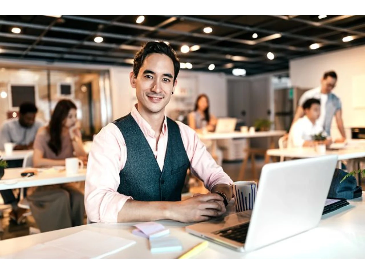 Man working on a desk with laptop