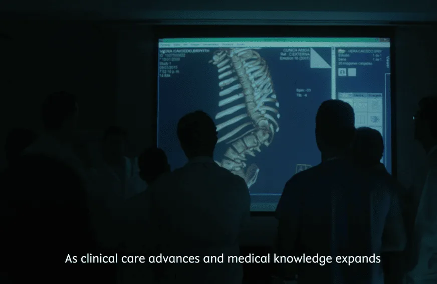 CotF Innovation through Health Education video capture: Doctors in a room looking at spinal graphic