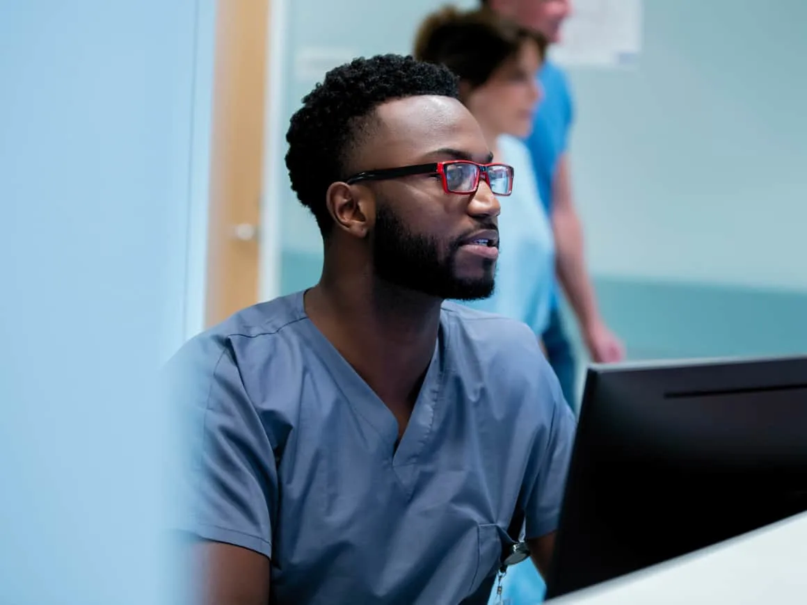 Nurse working computer Hospital Benefit