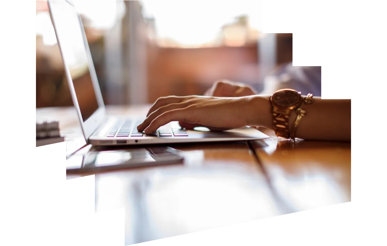 Side view of person typing on laptop keyboard