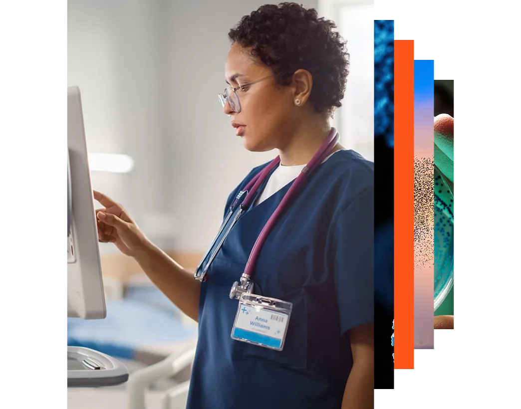 Black female head nurse using computer to monitor care vitals