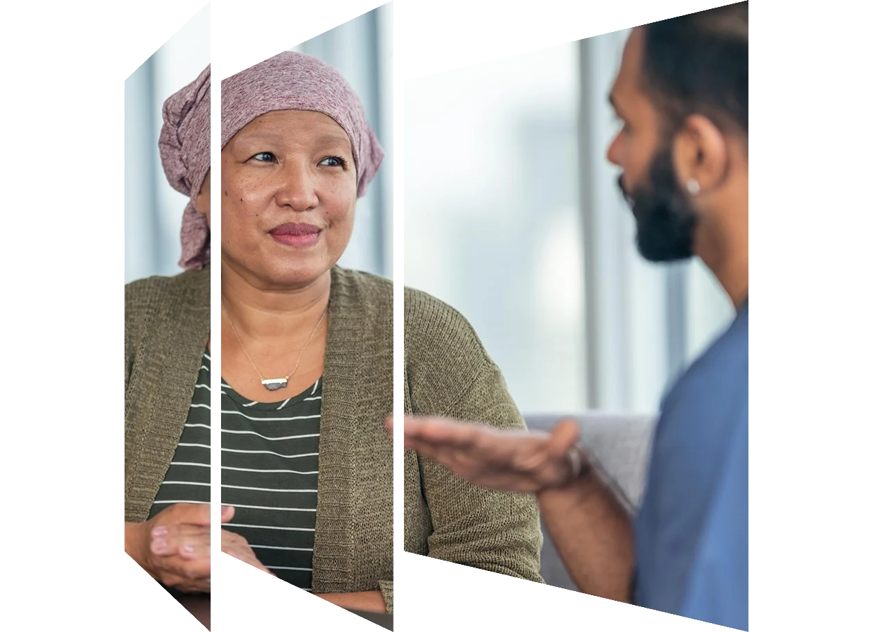 Clinician sharing notes with patient at bedside