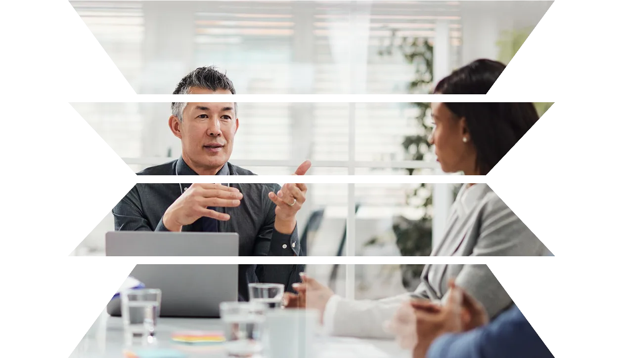 Asian manager talking to his colleagues in a meeting in the office