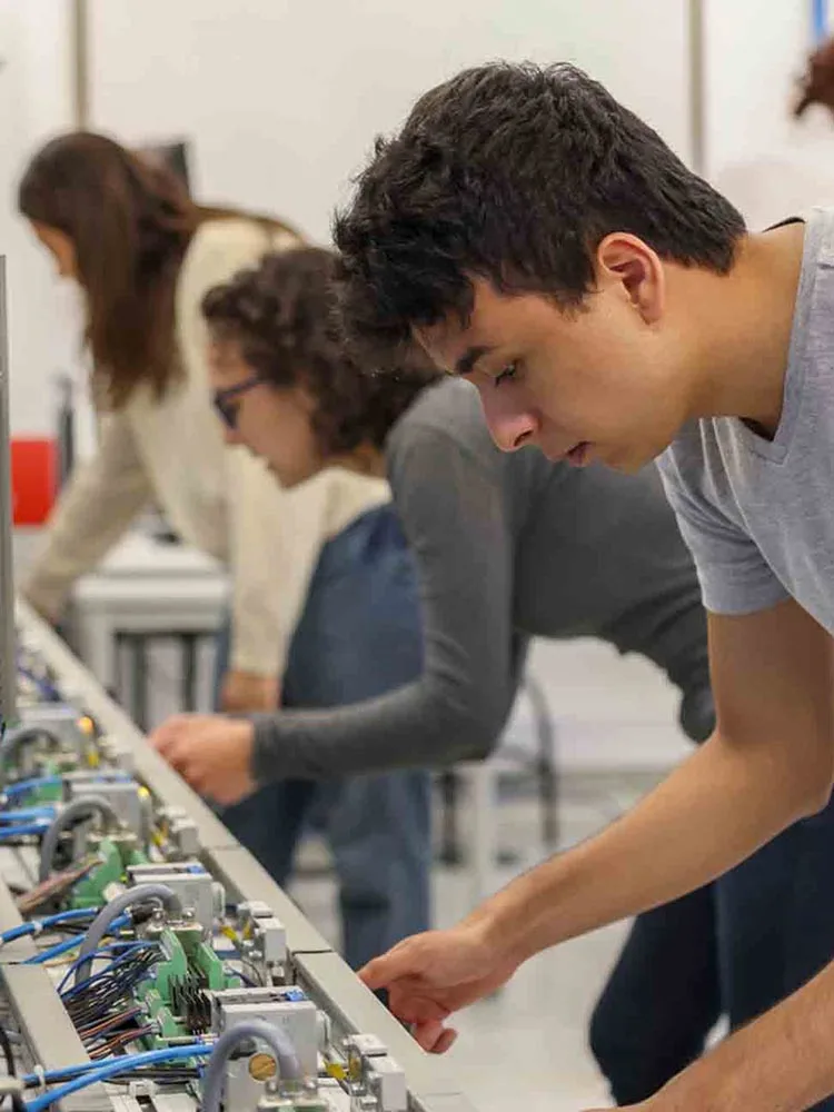 Engineering students working in a robotics lab