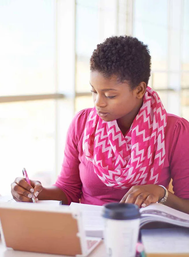 Student researcher author writing at desk with laptop image banner