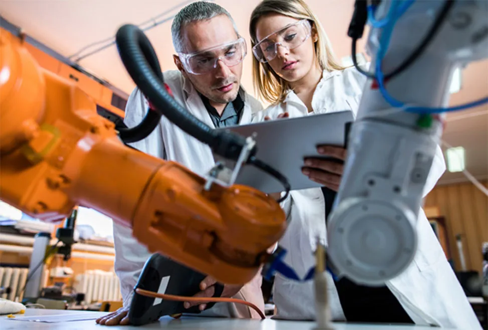 Two technicians in industrial lab