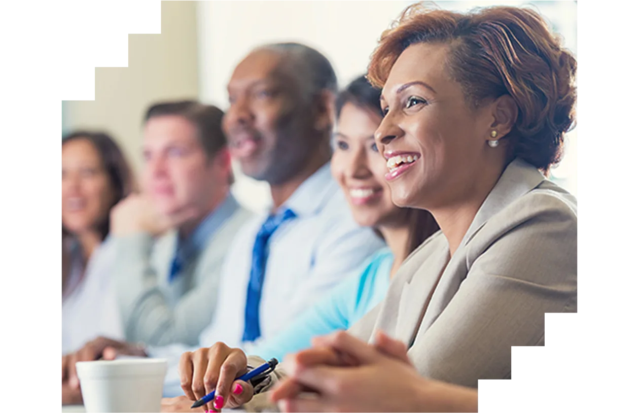Smiling professionals in a meeting