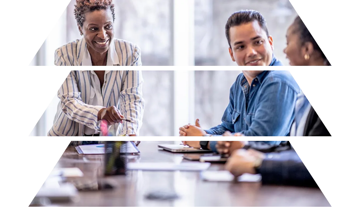 A group of business professionals sitting brainstorming around a table