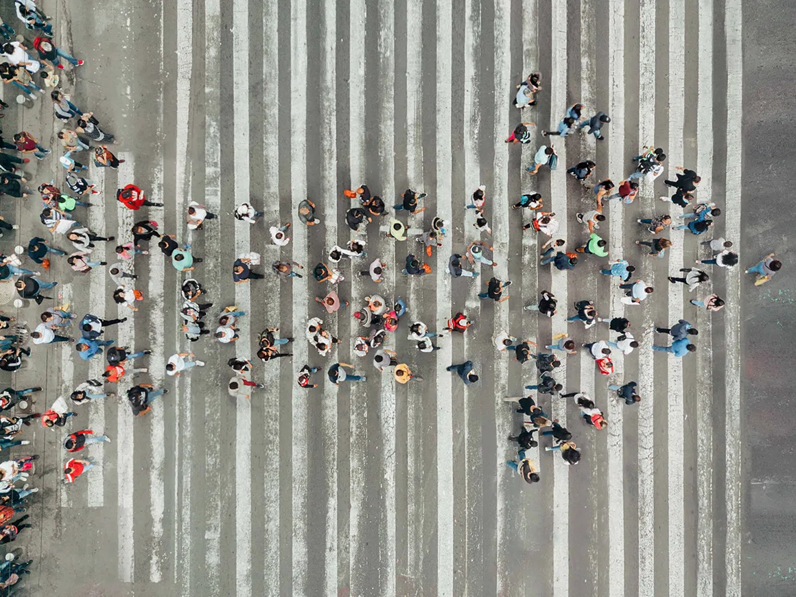 Birds eye view of a crowd crossing the street