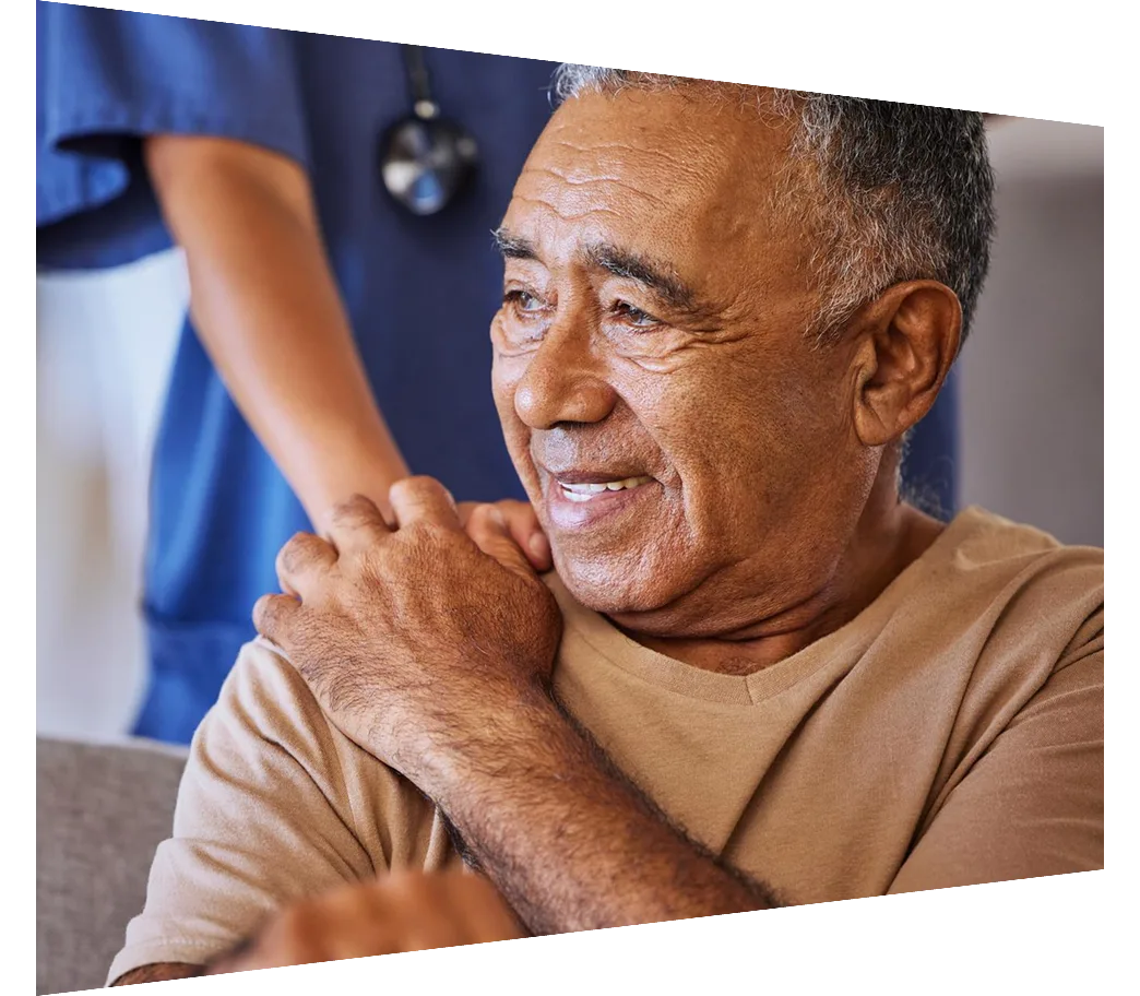 Caregiver holding hand of a sad senior patient 