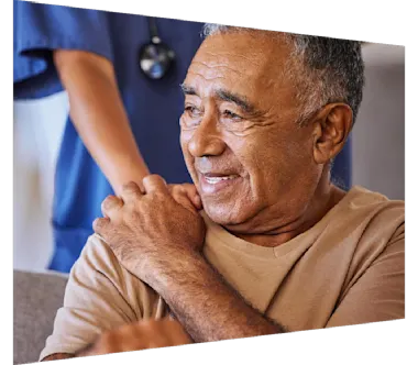 Caregiver holding hand of a sad senior patient 