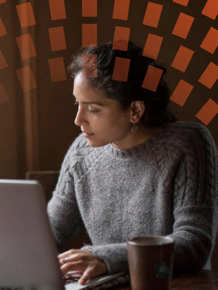 Young author working at home on laptop