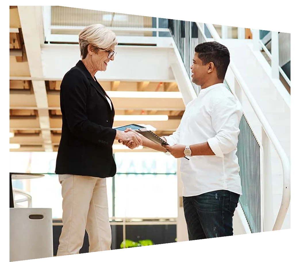Two colleagues shaking hands on a partnership