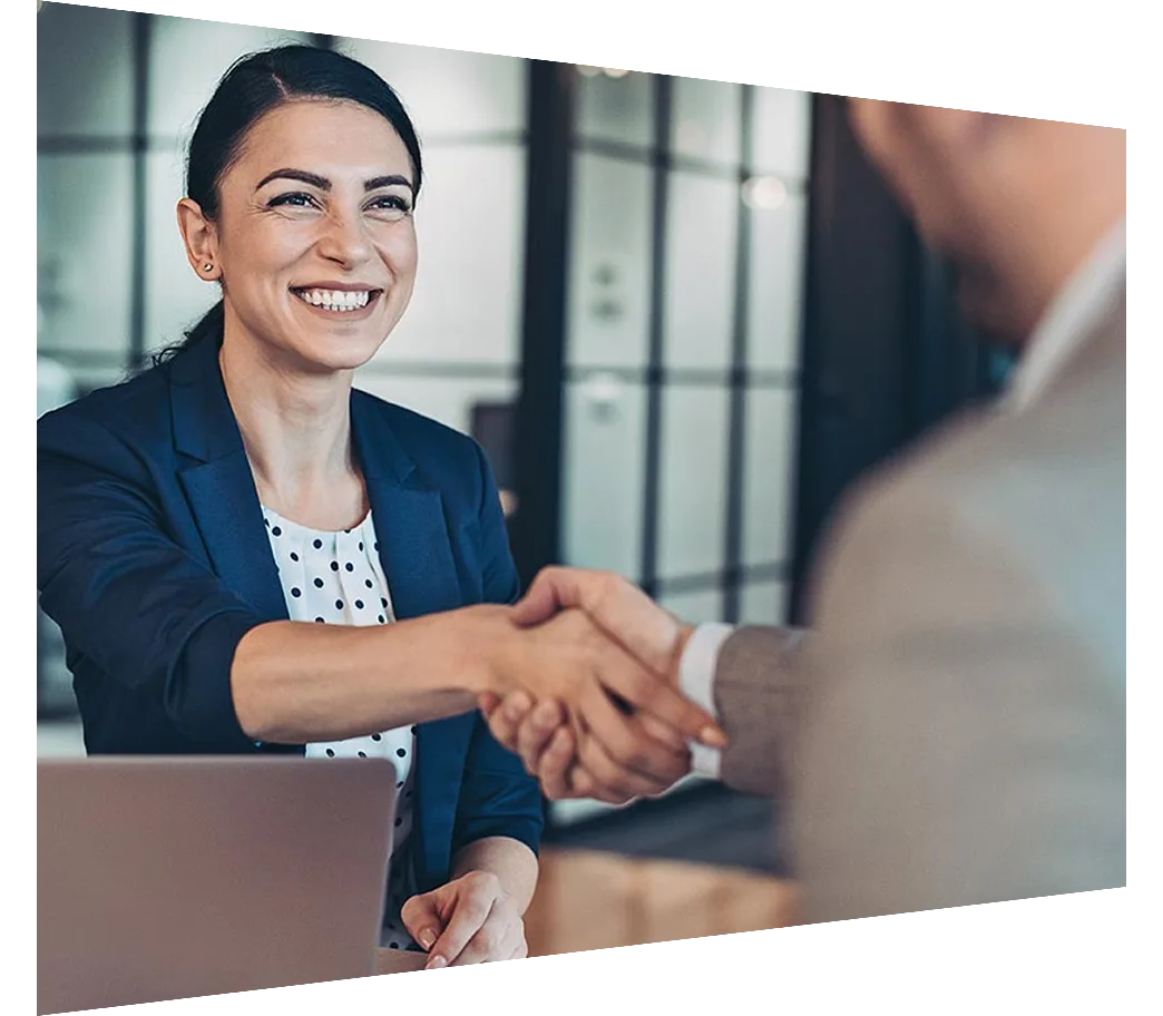 Female businesswoman shaking hands with a businessman