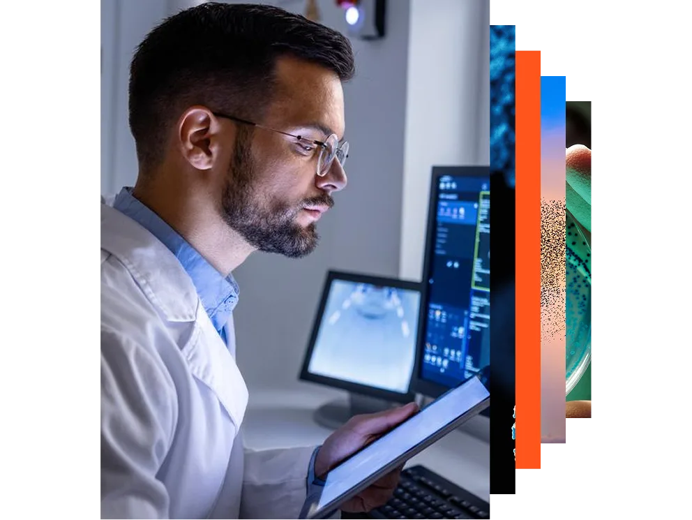 Young asian woman working at a desk with multiple monitors