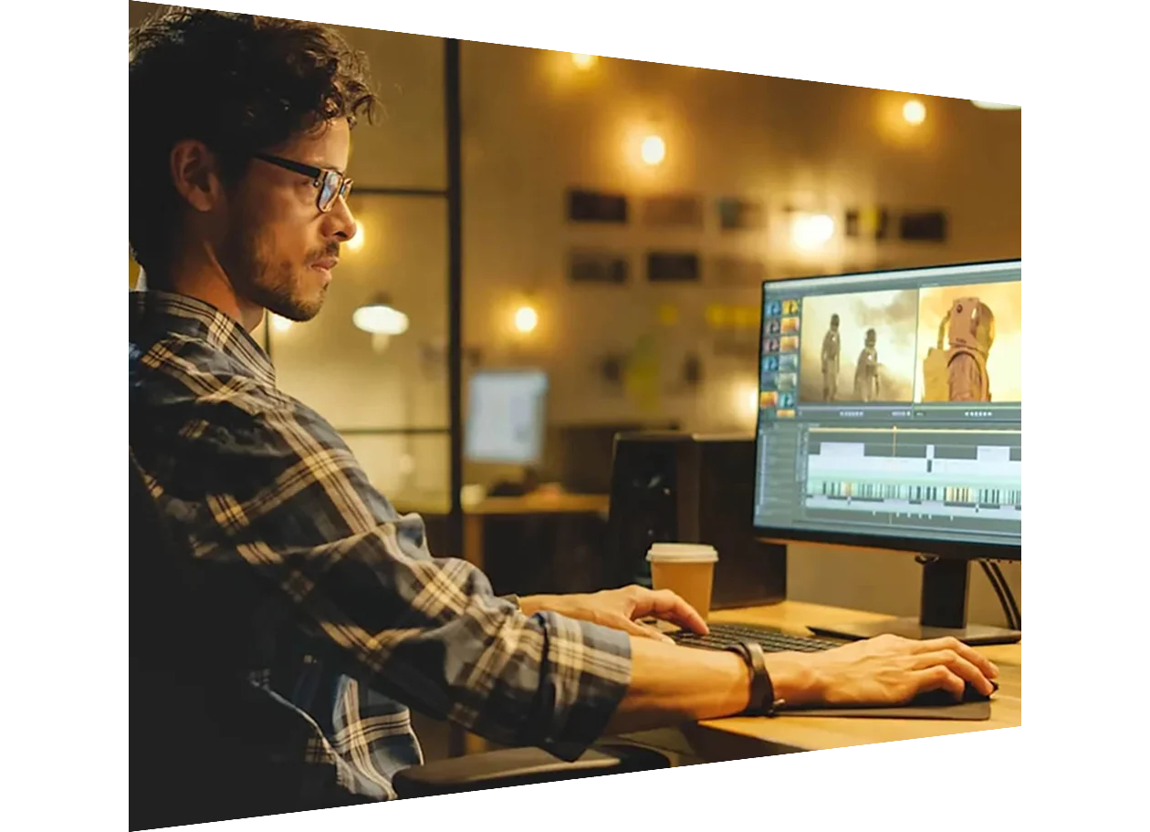 Male researcher working at desk in evening