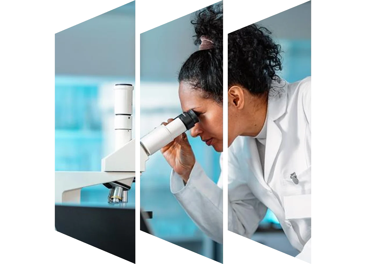 Female scientist looking at chemistry flask