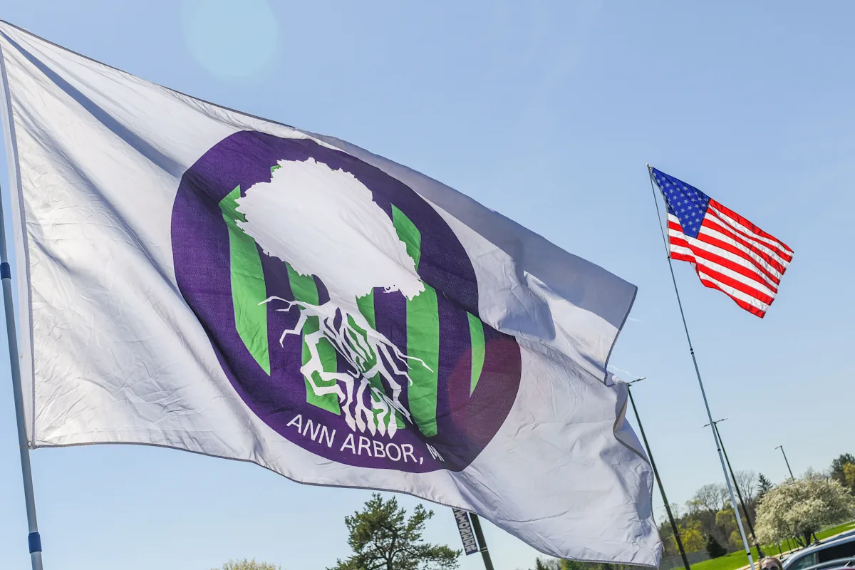 An MSH flag flies with the American flag in the background