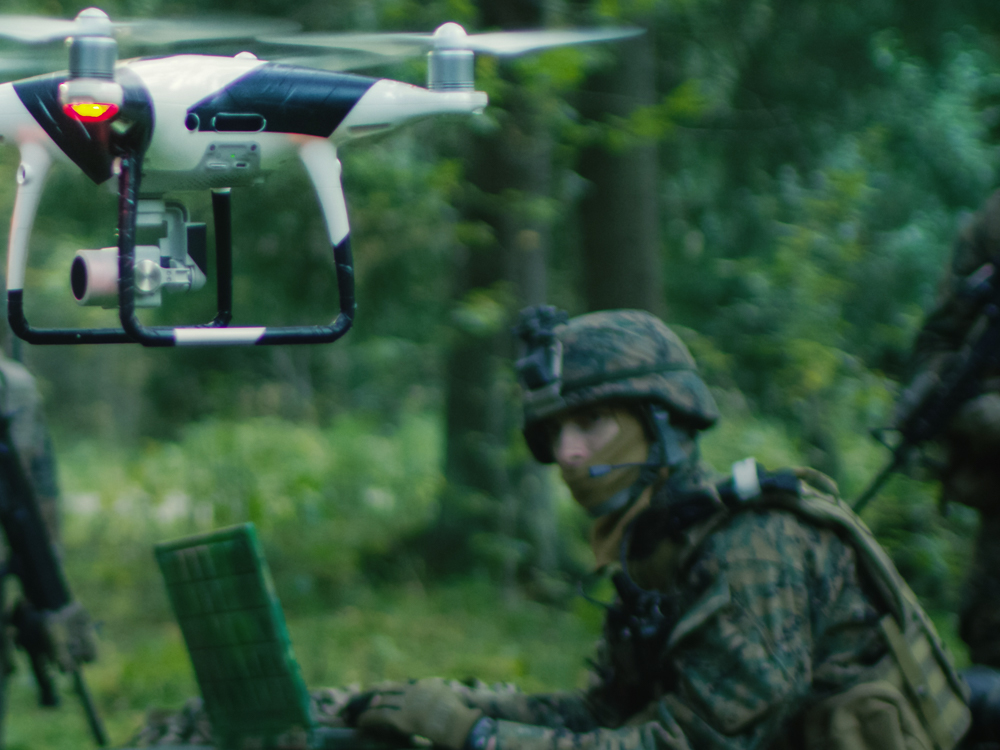 A soldier and a drone. 