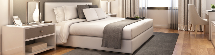 Ein Schlafzimmer mit einem modernen Bett und zwei Nachttischen