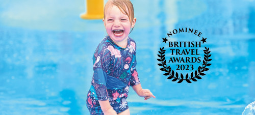 The BTA 2023 awards logo and an image of a young girl enjoying a Haven splashzone