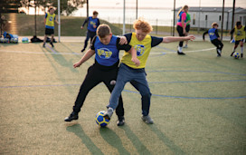 Children between 5-12 years playing football together with Football Fun Factory.