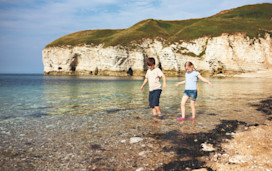 Paddling at the beach near Thornwick Bay