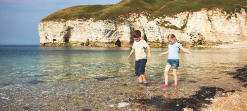 Paddling at the beach near Thornwick Bay