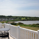 Deck on a sea view holiday home at Littlesea