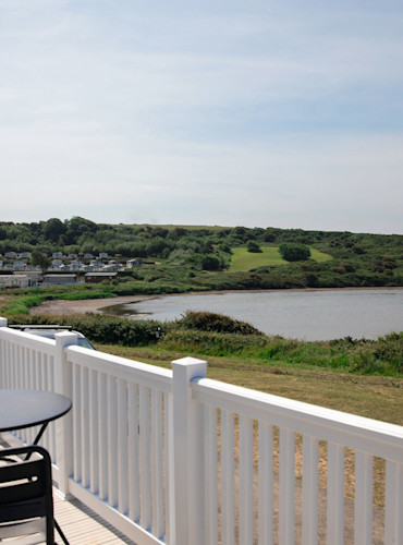 Deck on a sea view holiday home at Littlesea