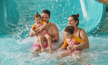 A family enjoying the water park at Seashore holiday park in Norfolk