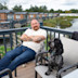 Dog with his owner on a caravan decking