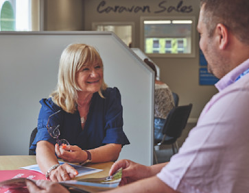 Chatting about caravans for sale in the Sales Office at Cleethorpes Beach