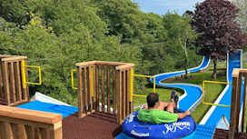 Haven team member getting ready to ride the tube slide at Devon Cliffs