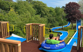 Haven team member getting ready to ride the tube slide at Devon Cliffs