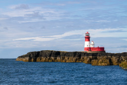 A view of a Longstone Lighthouse overlooking the sea in Northumberland.