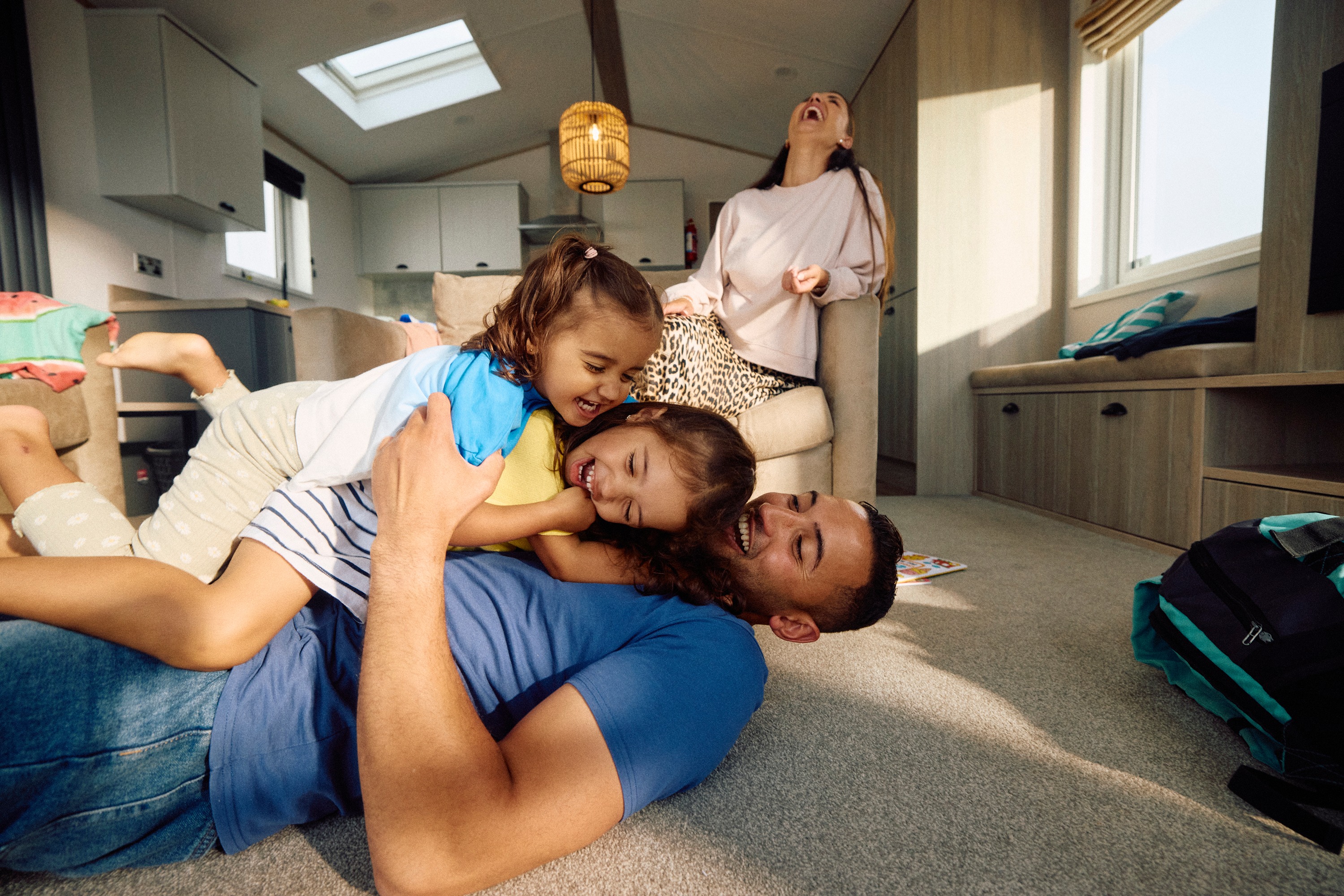 Family of four having fun in the caravan