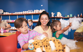 A tot and older child enjoy getting creative in a Make a Bear session at Haven.