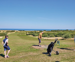 Golfers on one of the holes at the golf course at Reighton Sands