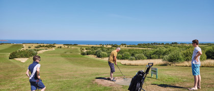 Golfers on one of the holes at the golf course at Reighton Sands