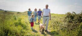 Family walking the dog at the nature reserve